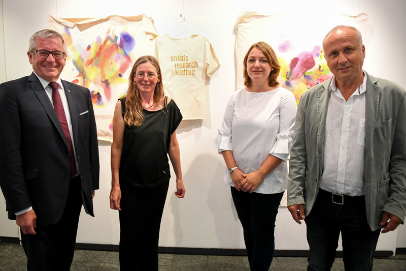Kirsten Kötter: Artistic research Landtag. In: Bewegte Zeiten, exhibition, Landtag Rheinland-Pfalz,
  Abgeordnetenhaus Mainz, Germany, 04.09.2019 - 10.10.2019, exhibition opening, left to right: Hans-Josef Bracht
  (vice president of the Landtag), Kirsten Kötter (artist), Dr. Ana Karaminova (art historian),
  Dr. Paul Hirsch (artist). Photograph: Landtag Rheinland-Pfalz</span> / Andreas Linsenmann